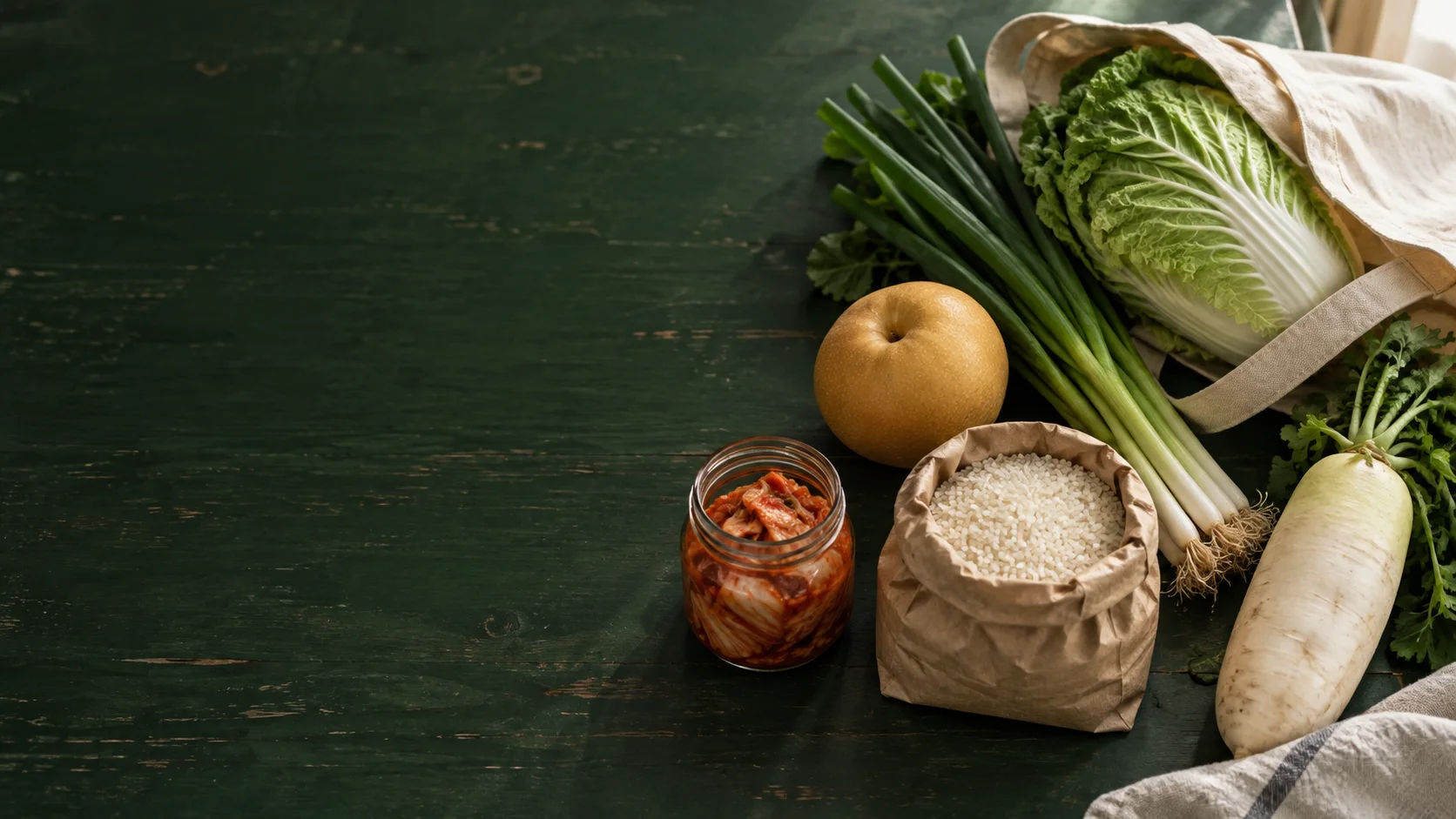 A market bag with napa cabbage, scallions and other groceries